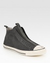 Canvas high-top design with a contrasting rubber toecap and sole, modernized by a laceless front. Leather liningPadded insoleRubber soleImported