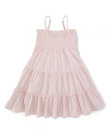 A stylish striped jersey dress is updated with smocked detailing and a pretty, flared silhouette. A stylish striped jersey dress is updated with smocked detailing and a pretty, flared silhouette.