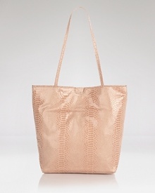 Carlos Falchi's python embossed tote is an exotic take on a classic shape. Metallic microfiber with an interior pouch, this sleek style strikes an enviable balance between practicality and polish. Carlos Falchi's python embossed tote is an exotic take on a classic shape. Metallic microfiber with an interior pouch, this sleek style strikes an enviable balance between practicality and polish.