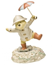 Inspired by the classic film starring Gene Kelly, Winnie the Pooh takes his turn at stomping through the rainy streets in this charming Disney figurine. Accented with 24-karat gold and measures 7.75. Inspired by the classic film starring Gene Kelly, Winnie the Pooh takes his turn at stomping through the rainy streets in this charming Disney figurine. Accented with 24-karat gold and measures 7.75.