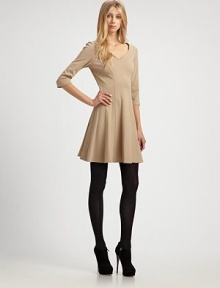 Flirty and flared, in a sturdy, ultra-flattering stretch knit.V necklineThree-quarter sleevesFlared skirtAbout 18 from natural waist65% rayon/30% nylon/5% spandexDry cleanMade in USA of imported fabricOUR FIT MODEL RECOMMENDS ordering true size. Flirty and flared, in a sturdy, ultra-flattering stretch knit.V necklineThree-quarter sleevesFlared skirtAbout 18 from natural waist65% rayon/30% nylon/5% spandexDry cleanMade in USA of imported fabricOUR FIT MODEL RECOMMENDS ordering true size.