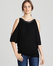 A faux-leather neckline toughens up this Bailey 44 top, cut in an ultra billowy silhouette with slit dolman sleeves.