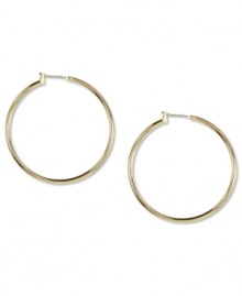 Go for big time fashion! These Anne Klein hoop earrings boast a large design and click-top closure. Crafted in gold tone mixed metal. Approximate diameter: 1-1/2 inches.