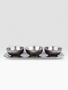 A unique mottling technique lends a hand-thumbed, hammered design to a beautiful metallic pewter set with the look of an old-world favorite. Includes a tray and three bowls 5¾W X 13½L Dishwasher, oven and microwave safe Imported