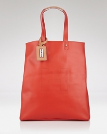 Inspired by their iconic boots, Hunter's rubber tote has a distinctly practical design. With a roomy interior and leather trims, this bag is a go-anywhere style that's chic rain or shine. Inspired by their iconic boots, Hunter's rubber tote has a distinctly practical design. With a roomy interior and leather trims, this bag is a go-anywhere style that's chic rain or shine.