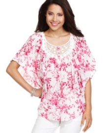 Lovely lace makes a statement on BandolinoBlu's flowing batwing top! The spring-ready floral print gives it extra charm.