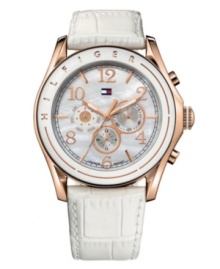 Everyday elegance, by Tommy Hilfiger. Watch crafeted of white croc-embossed leather strap and round rose-gold-plated stainless steel case. White bezel with rose-gold tone logo detail. Mother-of-pearl chronograph dial features rose-gold tone numerals and stick indices at markers, three subdials, luminous hands, and iconic flag logo at twelve o'clock. Quartz movement. Water resistant to 50 meters. Ten-year limited warranty. Everyday elegance, by Tommy Hilfiger. Watch crafeted of white croc-embossed leather strap and round rose-gold-plated stainless steel case. White bezel with rose-gold tone logo detail. Mother-of-pearl chronograph dial features rose-gold tone numerals and stick indices at markers, three subdials, luminous hands, and iconic flag logo at twelve o'clock. Quartz movement. Water resistant to 50 meters. Ten-year limited warranty.
