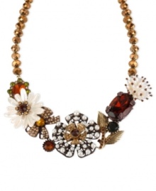 Flaunt a bouquet of fabulousness with Betsey Johnson's frontal necklace. A faceted bead chain displays gold tone chain-wrapped details, a brown tone flower, glass pearl, crystal accents, pearl-colored flowers, oval crystal gems and gold tone leaves. Crafted in brown topaz tone mixed metal. Approximate length: 16 inches + 3-inch extender. Approximate drop: 1-3/4 inches.