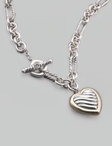 A striking chain, combining oval and circle links, both smooth and textured, holds a pretty cable heart charm framed in 18k yellow gold. Sterling silver and 18k yellow gold Chain length, about 16 Pendant length, about ¾ Toggle closure Made in USA A striking chain, combining oval and circle links, both smooth and textured, holds a pretty cable heart charm framed in 18k yellow gold. Sterling silver and 18k yellow gold Chain length, about 16 Pendant length, about ¾ Toggle closure Made in USA