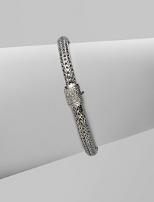 Diamond clasp accents sterling silver and 18K white gold chain bracelet. Pavé diamond, 0.17 tcw Push button close 7½ long Hand made in Bali Diamond clasp accents sterling silver and 18K white gold chain bracelet. Pavé diamond, 0.17 tcw Push button close 7½ long Hand made in Bali