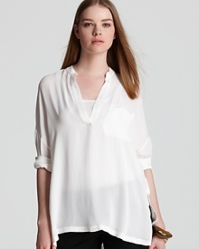 Taking a minimalist approach to warm weather dressing, this airy Vince tunic offers a chic solution to topping off your most staple styles.