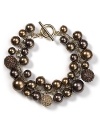 In a rich hue, Carolee's clustered pearl charm bracelet is understated by stylish, perfect to wear now and for seasons to come.