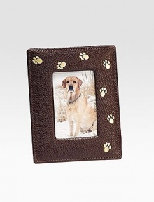 Handcrafted of French goatskin with a gold trail of paw prints, it's an ideal display for the four-legged love of your life. Holds 2¾ X 3¾ photo Made in USA Additional InformationShipping timeline for this itemThis item cannot be shipped via Rush, Next Business Day, Saturday delivery.This item cannot be shipped to a P.O. Box, APO/FPO or U.S. Territory. This item will ship directly from the vendor. Gift wrap not available for this item. Handcrafted of French goatskin with a gold trail of paw prints, it's an ideal display for the four-legged love of your life. Holds 2¾ X 3¾ photo Made in USA Additional InformationShipping timeline for this itemThis item cannot be shipped via Rush, Next Business Day, Saturday delivery.This item cannot be shipped to a P.O. Box, APO/FPO or U.S. Territory. This item will ship directly from the vendor. Gift wrap not available for this item.