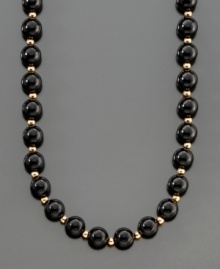 A dramatic and striking necklace featuring onyx beads (8 mm) separated by polished 14k gold beads. Length measures 30 inches. A dramatic and striking necklace featuring onyx beads (8 mm) separated by polished 14k gold beads. Length measures 30 inches.