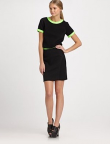 Contrast binding and an exposed back zipper embellish this pique jersey crop-top.Jewel necklineShort raglan sleevesFlat frontCenter back zipperAbout 17 from shoulder to hem79% cotton/20% nylon/1% LycraDry cleanMade in USA of imported fabricModel shown is 5'11 (180cm) wearing US size Small. Contrast binding and an exposed back zipper embellish this pique jersey crop-top.Jewel necklineShort raglan sleevesFlat frontCenter back zipperAbout 17 from shoulder to hem79% cotton/20% nylon/1% LycraDry cleanMade in USA of imported fabricModel shown is 5'11 (180cm) wearing US size Small.