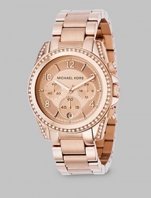 A classic chronograph with designer style, in IP (ionic plating) rose gold stainless steel with sparkling accents of Swarovski crystal. A classic chronograph with designer style, in IP (ionic plating) rose gold stainless steel with sparkling accents of Swarovski crystal.
