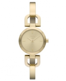 DKNY takes a ladylike turn with this golden bangle watch. DKNY takes a ladylike turn with this golden bangle watch.