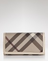 Burberry's iconic check print in muted neutrals lends sophisticated style to this leather trimmed continental wallet.