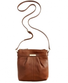 Simple and seriously chic, this versatile crossbody from Calvin Klein adds just the right amount of polish to your everyday attire. The sleek shape, neutral hue and refined detailing make it the obvious choice in exquisite accessorizing. Simple and seriously chic, this versatile crossbody from Calvin Klein adds just the right amount of polish to your everyday attire. The sleek shape, neutral hue and refined detailing make it the obvious choice in exquisite accessorizing.