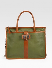 Rich pebble-grain calfskin paired with sleek contrast trim in a roomy carryall finished with a demure stud and chain-link bow.Double top handles, 6 dropLeather-and-chain shoulder strap, 18 dropTop zip closureOne outside zip pocketProtective metal feetOne inside zip pocketTwo inside open pocketsFully lined14W X 10¾H X 5¼DMade in Italy Rich pebble-grain calfskin paired with sleek contrast trim in a roomy carryall finished with a demure stud and chain-link bow.Double top handles, 6 dropLeather-and-chain shoulder strap, 18 dropTop zip closureOne outside zip pocketProtective metal feetOne inside zip pocketTwo inside open pocketsFully lined14W X 10¾H X 5¼DMade in Italy