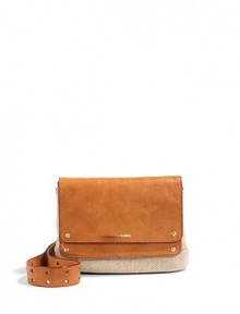 THE LOOKAdjustable leather crossbody strapCanvas constructionFold-over leather flap with logo print on the frontMagnetic flap closureOne outside zip pocket under the flapID slip pocket on the flapOne inside open pocketOne inside zip pocketInside logo detailTHE MEASUREMENTCrossbody strap, 12-24 drop9W X 7H X 3DTHE MATERIALCanvasLeatherFully linedORIGINImported THE LOOKAdjustable leather crossbody strapCanvas constructionFold-over leather flap with logo print on the frontMagnetic flap closureOne outside zip pocket under the flapID slip pocket on the flapOne inside open pocketOne inside zip pocketInside logo detailTHE MEASUREMENTCrossbody strap, 12-24 drop9W X 7H X 3DTHE MATERIALCanvasLeatherFully linedORIGINImported