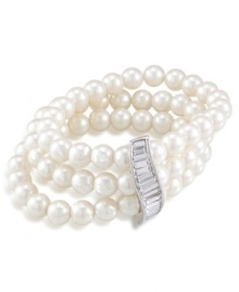 A final touch of elegance. Turn any event into a special one with Carolee's sophisticated three-row bracelet. Glass pearls combine with a sparkling glass spacer set in silver tone mixed metal. Bracelet stretches to fit wrist. Approximate diameter: 3-1/4 inches.