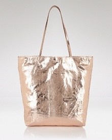 Carlos Falchi's tote is a luxe take on a classic shape. In metallic micro-fiber with an interior pouch, this style strikes an enviable balance between practicality and polish. Carlos Falchi's tote is a luxe take on a classic shape. In metallic micro-fiber with an interior pouch, this style strikes an enviable balance between practicality and polish.