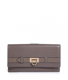 Elegant wallet in supple taupe leather - A standout, ladylike luxe accessory from Salvatore Ferragamo - Classic style, smart design - Oblong envelope shape with flap - Interior zip pocket, room for coins, bills and credit cards - Chic hardware logo detail - Timeless and sophisticated, great as a gift for you or someone else Elegant wallet in supple taupe leather - A standout, ladylike luxe accessory from Salvatore Ferragamo - Classic style, smart design - Oblong envelope shape with flap - Interior zip pocket, room for coins, bills and credit cards - Chic hardware logo detail - Timeless and sophisticated, great as a gift for you or someone else