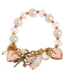 Charm your heart. Betsey Johnson's bracelet highlights pink faceted beads and glass pearls on a half-stretch chain. Bracelet is decorated with pink-colored lucite hearts with crystal accents, gold tone bow with pink-colored crystal accent and round crystal disc. Set in gold tone mixed metal. Approximate length: 7-1/2 inches.