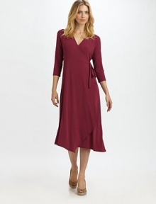 Universally flattering, this wrap dress offers a slightly-relaxed fit.V-neckThree-quarter sleevesWrap-front designAsymmetrical hemAbout 47 from shoulder to hem92% rayon/8% Lycra®Machine washMade in USA of imported fabric