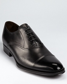 A subtly new spin on a classic. This sleek dress shoe from To Boot New York is crafted in fine Italian leather that darkens toward a perforated cap toe. A subtly new spin on a classic. This sleek dress shoe from To Boot New York is crafted in fine Italian leather that darkens toward a perforated cap toe.