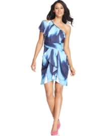 Flirty features make Vince Camuto's dress a must-have this season. Asymmetrical details, a shoulder cutout and a cascading ruffle at the front skirt are all show-stoppers.