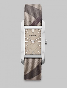 A true signature design with a check etched dial and a check strap. Quartz movementWater resistant to 3 ATMRectangular stainless steel case, 20mm (0.8) X 26mm (1)Smooth bezelSilver check stamped dialBar hour markersTrench smoke check strapMade in Switzerland A true signature design with a check etched dial and a check strap. Quartz movementWater resistant to 3 ATMRectangular stainless steel case, 20mm (0.8) X 26mm (1)Smooth bezelSilver check stamped dialBar hour markersTrench smoke check strapMade in Switzerland