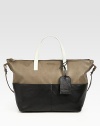 Blocks of rich matte leather add a touch of modernist-chic to this roomy carryall.Double top handles, 5¼ dropShoulder strap, 14 dropTop zip closureFour outside open pocketsProtective metal feetOne inside zip pocketOne inside open pocketFully lined12W X 10¼H X 7DMade in Italy