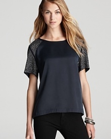A silk Rebecca Taylor tee is dotted at the sleeves with edgy studs for a directional take on a laid-back style. A silk Rebecca Taylor tee is dotted at the sleeves with edgy studs for a directional take on a laid-back style.