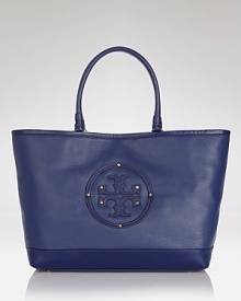 Clean lines and a strong shape makes Tory Burch's tote both classic and modern. Crafted from luxurious leather with a spacious design, it's a practically perfect for running errands. Clean lines and a strong shape makes Tory Burch's tote both classic and modern. Crafted from luxurious leather with a spacious design, it's a practically perfect for running errands.