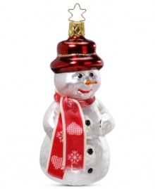 Dressed for the occasion! This Inge-Glas snowman is all decked out with a red hat and coordinating scarf, making him the coolest ornament on your Christmas tree. Mouth-blown and hand-painted.