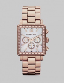 Show your true sparkle in this warm, technical timepiece with a crystal bezel. Quartz movementWater resistant to 5 ATMRectangular rose goldtone stainless steel case, 35mm (1.3) X 32mm (1.2)Crystal bezelMother-of-pearl chronograph dialNumeric and bar hour markersDate display between 4 and 5 o'clockSecond hand Rose goldtone stainless steel link braceletImported 