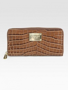 Chic and luxurious crocodile embossed leather design with a logo plaque.Zip-around closureOne inside zip pocketEight credit card slotsTwo bill compartmentsFully lined8¼W X 4H X ¾DImported Chic and luxurious crocodile embossed leather design with a logo plaque.Zip-around closureOne inside zip pocketEight credit card slotsTwo bill compartmentsFully lined8¼W X 4H X ¾DImported