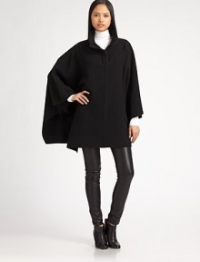 Rich wool fleece in a draped poncho style updated with a ribbed zip collar.Foldover collarDropped shouldersOpen sleevesPullover styleWoolDry cleanImportedModel shown is 5'11 (180cm) wearing US size Small.