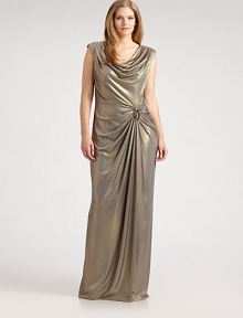 This shimmering, floor-sweeping design features an alluring cowlneck and waist-flattering gathered details, complemented exquisitely by rhinestone beading.CowlneckCap sleevesEmbellishment at gathered waistRuched back detailsBack zipperFully linedAbout 45 from natural waist92% polyester/8% spandexDry cleanImported