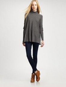 Eye-catching turtleneck with elegant, mock-layered poncho sleeves, ribbed trim and a long silhouette. Ribbed turtleneckDropped shouldersMock-layered sleevesRibbed cuffs and hemAbout 27 from shoulder to hem54% nylon/25% rayon/21% modalHand washImportedModel shown is 5'10 (177cm) wearing US size Small. Eye-catching turtleneck with elegant, mock-layered poncho sleeves, ribbed trim and a long silhouette. Ribbed turtleneckDropped shouldersMock-layered sleevesRibbed cuffs and hemAbout 27 from shoulder to hem54% nylon/25% rayon/21% modalHand washImportedModel shown is 5'10 (177cm) wearing US size Small.