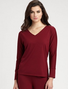 Ultra-soft stretch knit with a flattering neckline and long sleeves for the coziest evenings. V-neckLong sleevesBanded cuffsAbout 24 from shoulder to hemPolyester/rayon/spandexMachine washImported