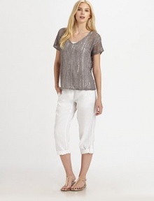 This airy knit with a hint of shimmer, thanks to metallic thread, also features a feminine neckline and beloved fit.V-neckShort sleevesPull-on styleAbout 24 from shoulder to hem83% linen/16% metallic thread/1% cottonHand washImported of Italian fabric Model shown is 5'10 (177cm) wearing US size Small. 