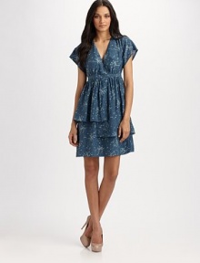 Delicate florals sprinkle throughout this layered silk frock.Crossover V neckline Short sleeves Empire waist Tiered ruffles at skirt Side zipper About 23 from natural waist Silk Dry clean Made in Italy of imported fabric Delicate florals sprinkle throughout this layered silk frock.Crossover V neckline Short sleeves Empire waist Tiered ruffles at skirt Side zipper About 23 from natural waist Silk Dry clean Made in Italy of imported fabric
