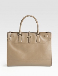 Butter-smooth culatta leather in a top handle tote, perfectly sized for all your essentials.Double top handle, 6 dropFlap strap over top zip closureOne outside zip pocketProtective metal feetOne inside zip pocketTwo inside open pocketsFully lined15¼W X 11H X 5¼DMade in Italy Butter-smooth culatta leather in a top handle tote, perfectly sized for all your essentials.Double top handle, 6 dropFlap strap over top zip closureOne outside zip pocketProtective metal feetOne inside zip pocketTwo inside open pocketsFully lined15¼W X 11H X 5¼DMade in Italy