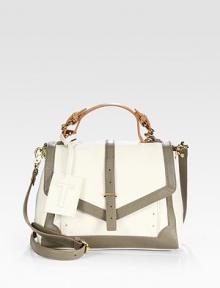 Gorgeous two-tone pebbled leather in a structured top-handle silhouette, finished with buckle detail.Adjustable top handle, 4-5 dropRemovable adjustable shoulder strap, 21¾-24 dropFlap closureOne outside zip pocketProtective metal feetTwo inside zip pocketsThree inside open pocketsCanvas lining11½W X 8½H X 4¼DImported Gorgeous two-tone pebbled leather in a structured top-handle silhouette, finished with buckle detail.Adjustable top handle, 4-5 dropRemovable adjustable shoulder strap, 21¾-24 dropFlap closureOne outside zip pocketProtective metal feetTwo inside zip pocketsThree inside open pocketsCanvas lining11½W X 8½H X 4¼DImported