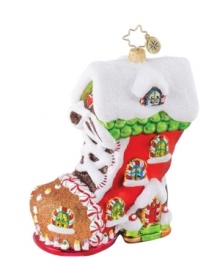 Fashion your tree the way you would a treat with the gingerbread-inspired Sweet Tooth Boot ornament. Christopher Radko decorates from heal to toe in shimmering white frosting and peppermint candies, all in handcrafted glass.