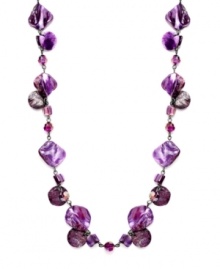 A pop of purple color leaves a lasting effect on your look. Style&co.'s long strand necklace features natural shells in a variety of purple hues. Set in mixed metal. Approximate length: 42 inches.