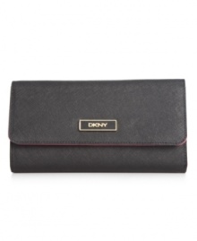 Stay organized anywhere you go with this travel-ready wallet from DKNY that's the right reserve for all your riches. Luxe leather is accented with custom hardware, while the interior is outfitted with plenty of pockets and compartments. Stay organized anywhere you go with this travel-ready wallet from DKNY that's the right reserve for all your riches. Luxe leather is accented with custom hardware, while the interior is outfitted with plenty of pockets and compartments.